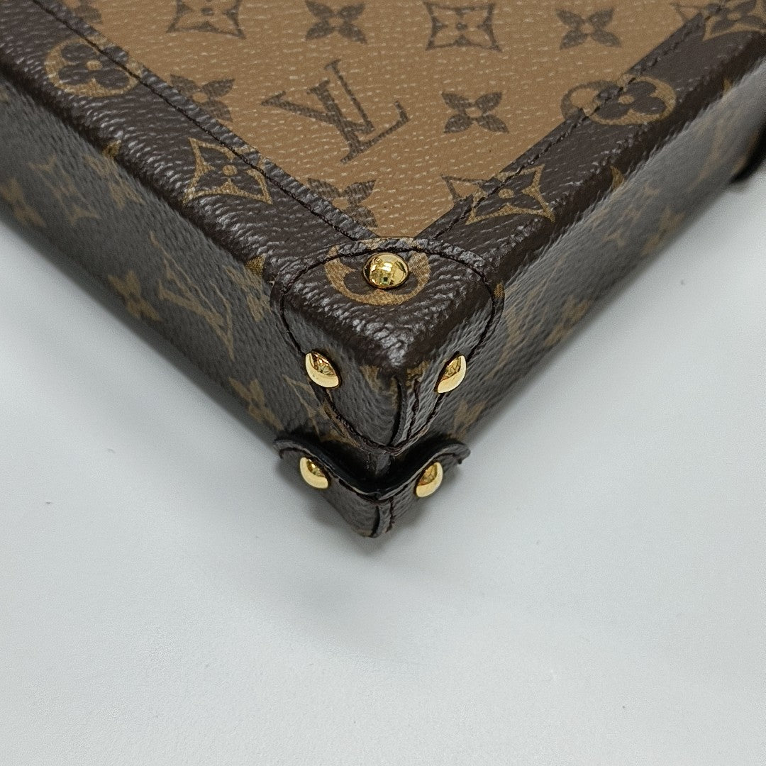 TRUNK Monogram Coated Canvas Brown