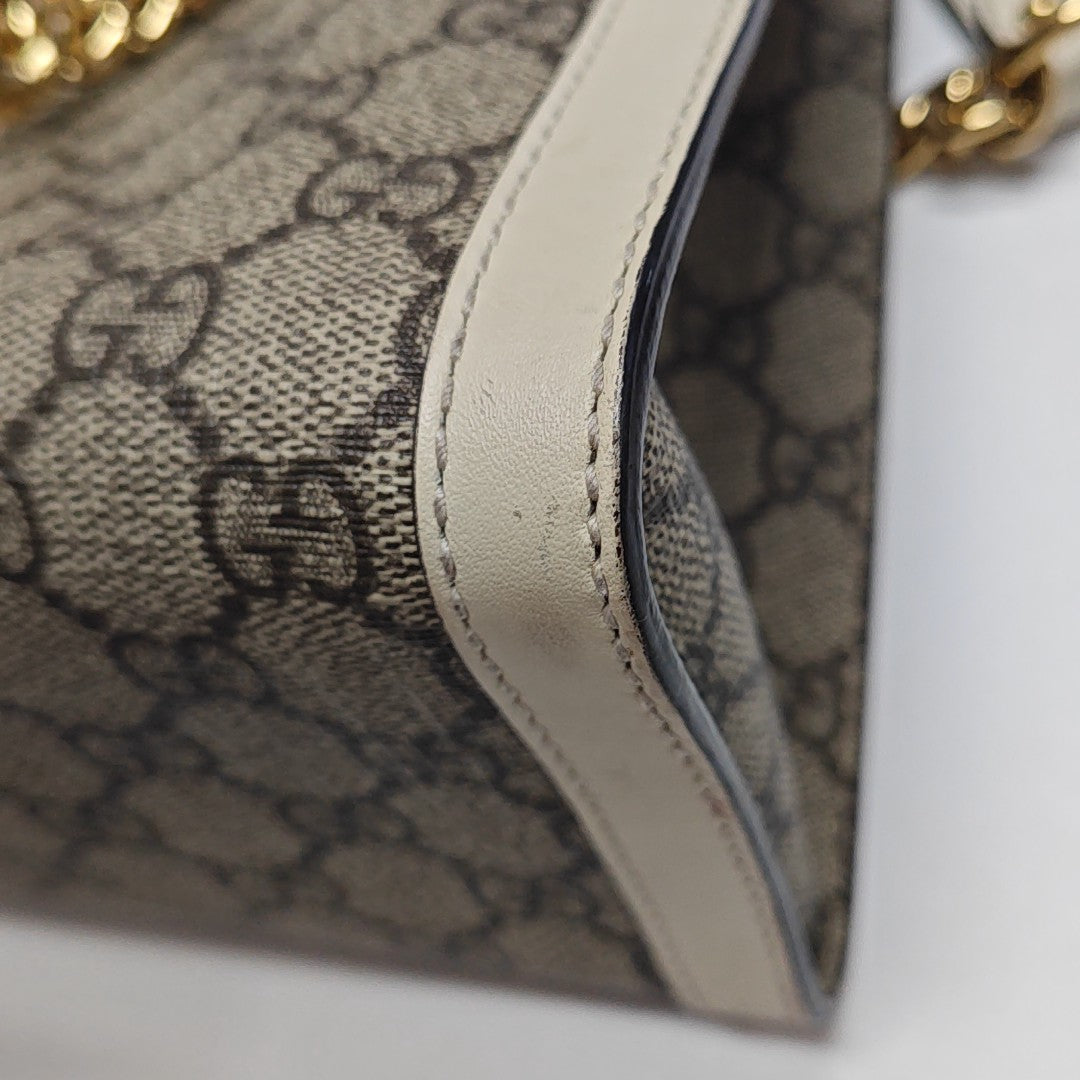 Padlock Small Monogram Coated Canvas Beige