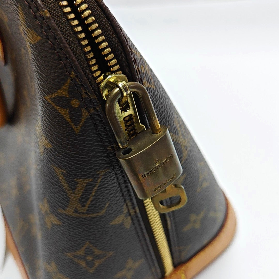 ALMA PM Monogram Coated Canvas Brown