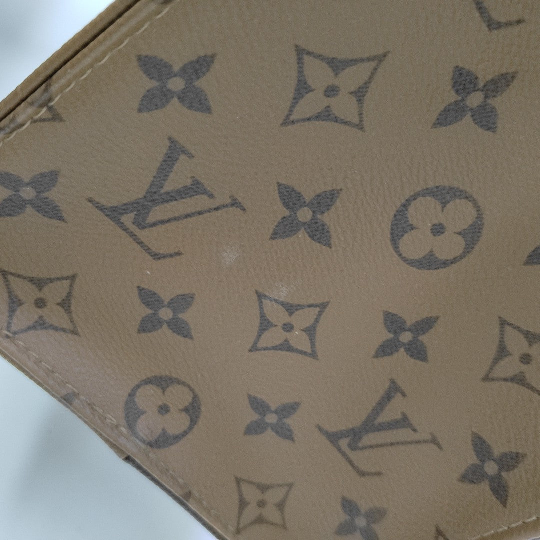ONTHEGO MM Monogram Coated Canvas Brown