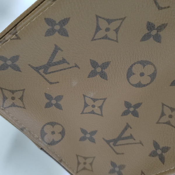 ONTHEGO MM Monogram Coated Canvas Brown