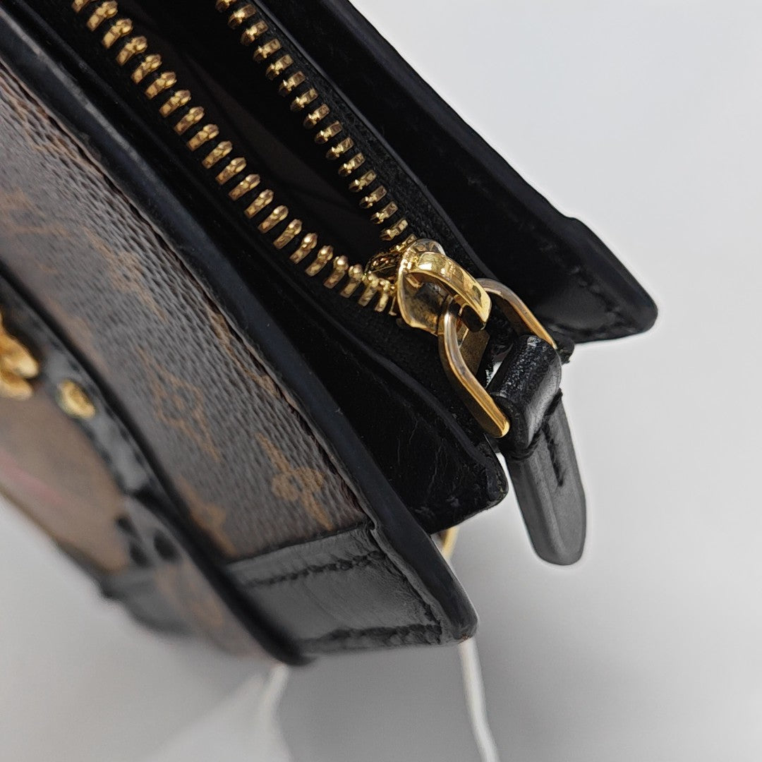 TRUNK Monogram Coated Canvas Brown