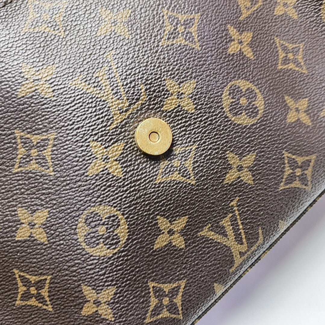 LOOPING PM Monogram Coated Canvas Brown