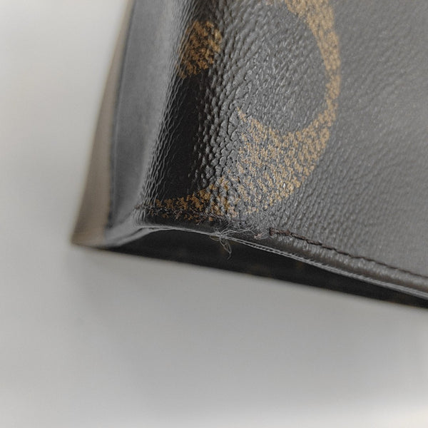 ONTHEGO MM Monogram Coated Canvas Brown