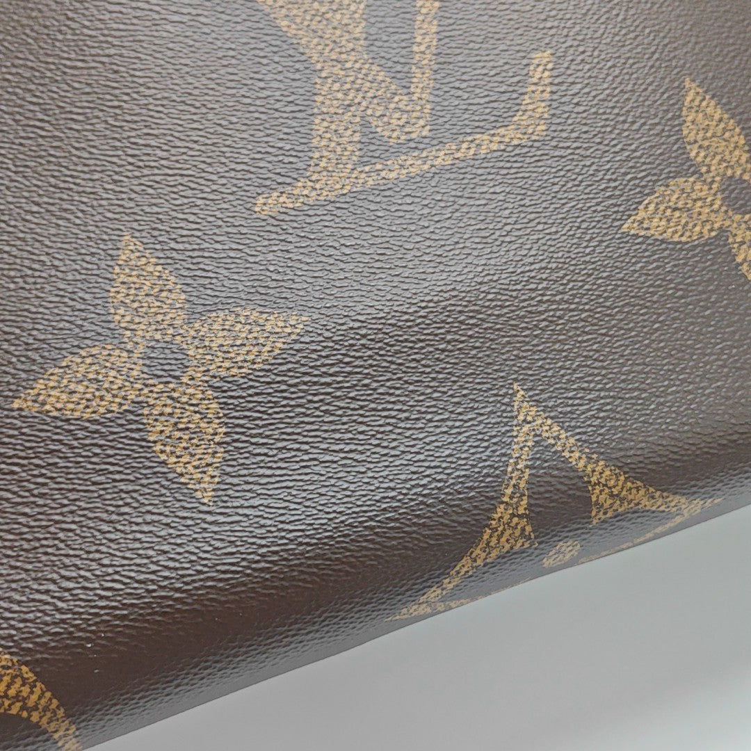 ONTHEGO MM Monogram Coated Canvas Brown