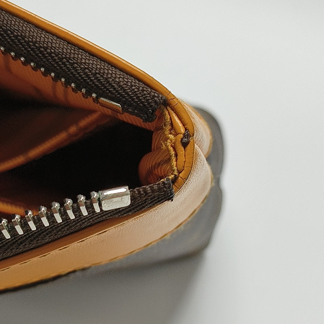 DAILY Monogram Coated Canvas Brown