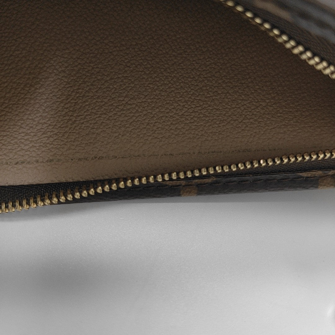 TOILET POCKET 19 Monogram Coated Canvas Brown