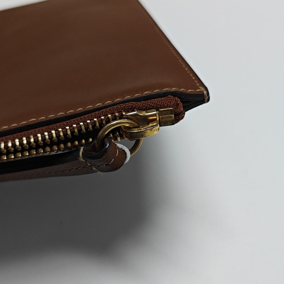Monogram Coated Canvas Clutch Beige