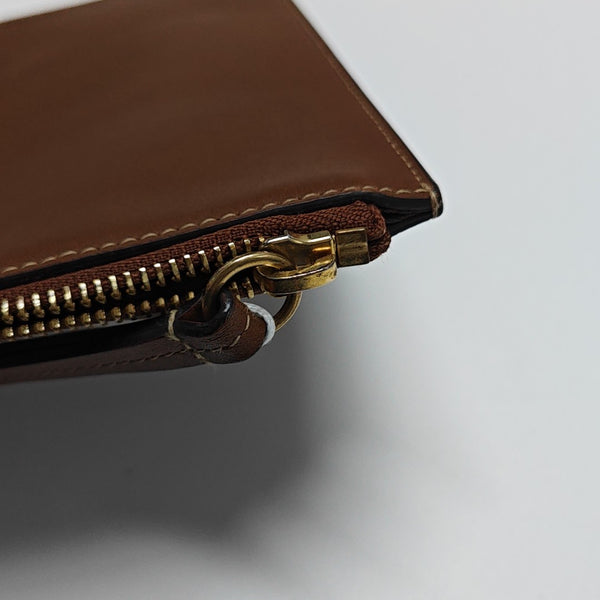 Monogram Coated Canvas Clutch Beige