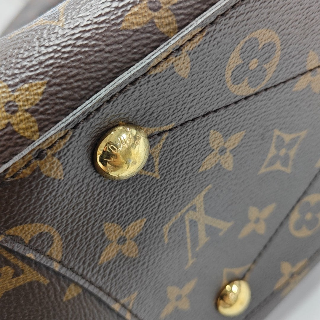 MONTAIGNE GM Monogram Coated Canvas Brown