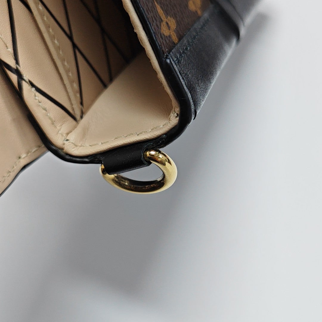 TRUNK Monogram Coated Canvas Brown