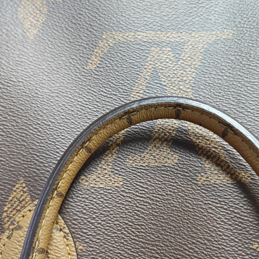 ONTHEGO MM Monogram Coated Canvas Brown