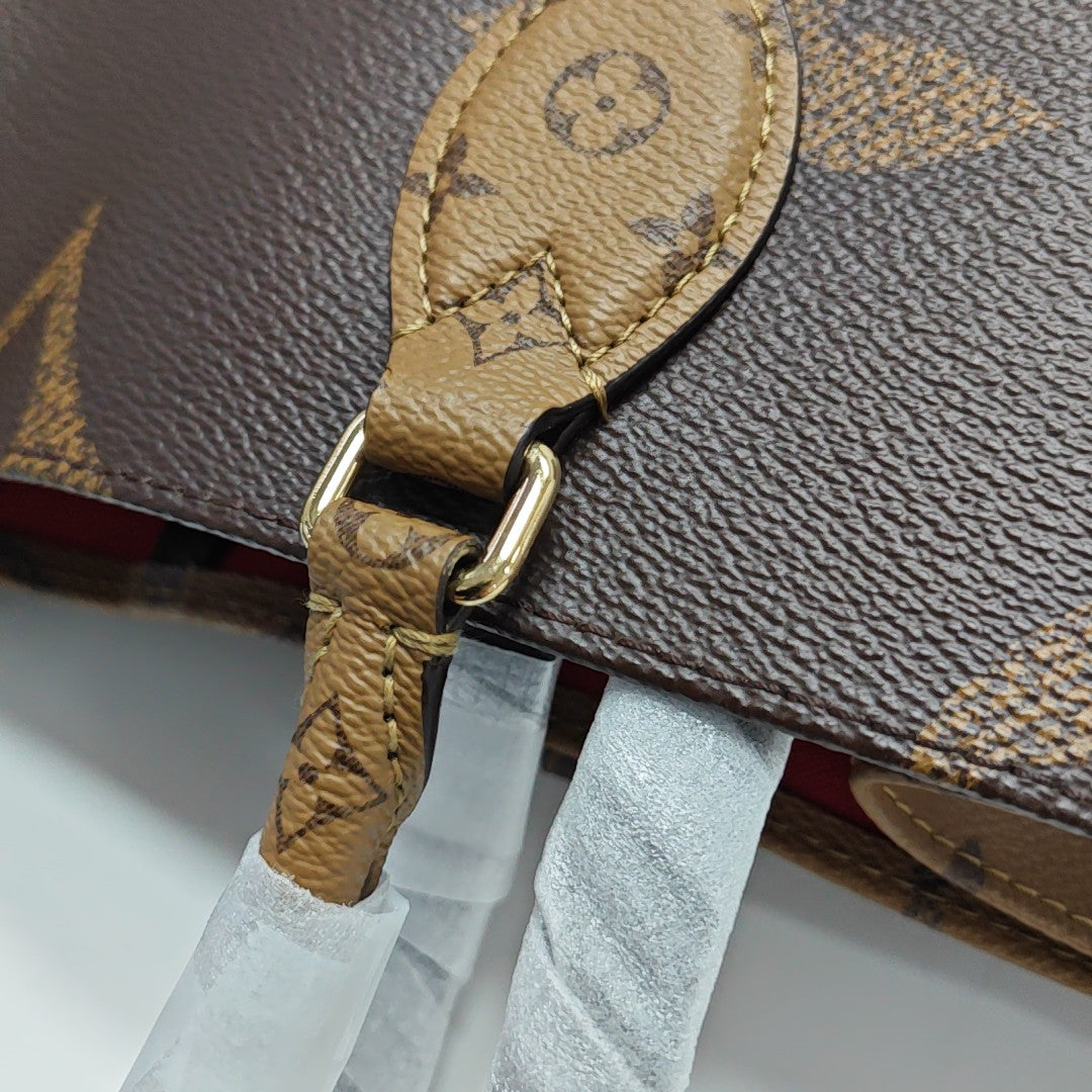 ONTHEGO MM Monogram Coated Canvas Brown