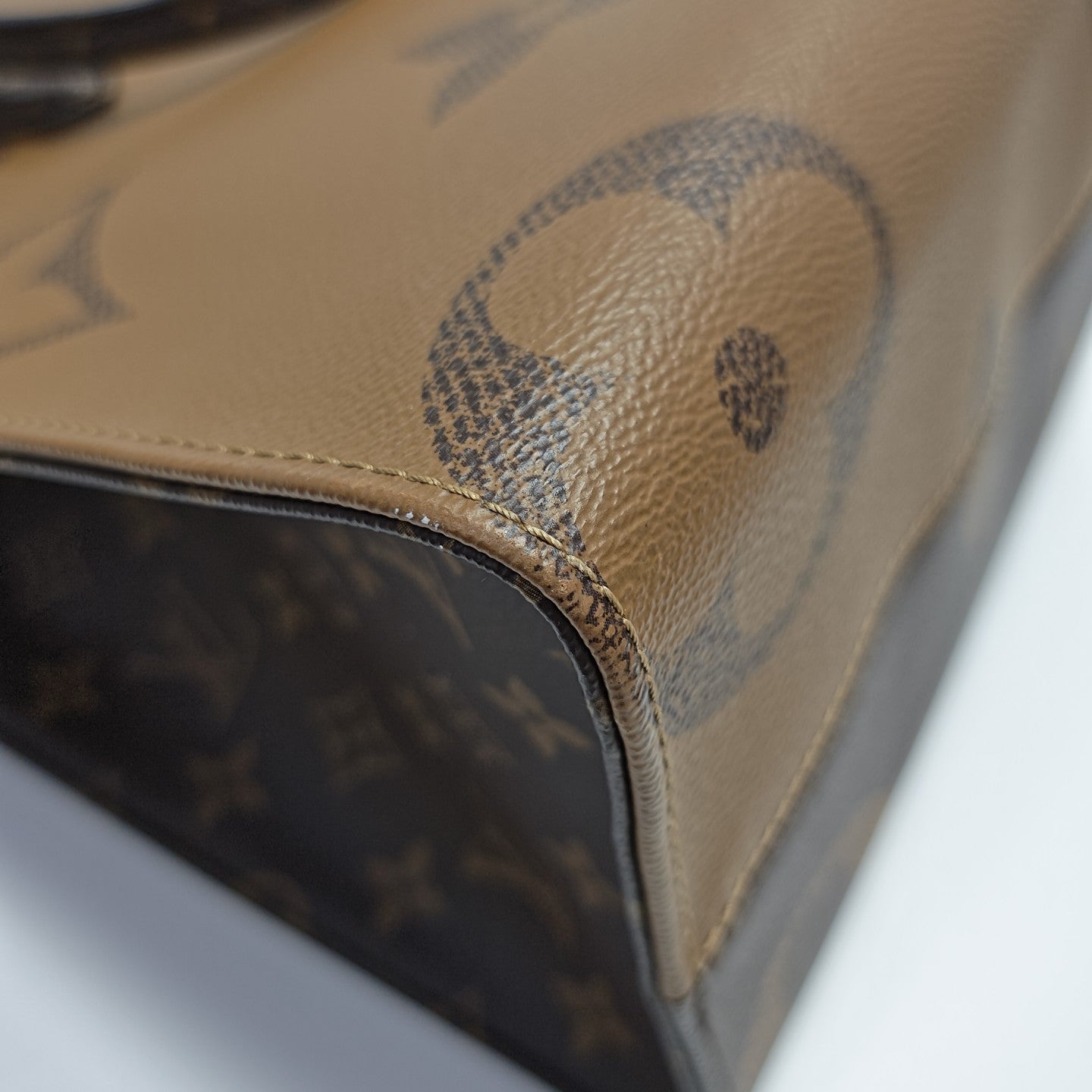 ONTHEGO MM Monogram Coated Canvas Brown