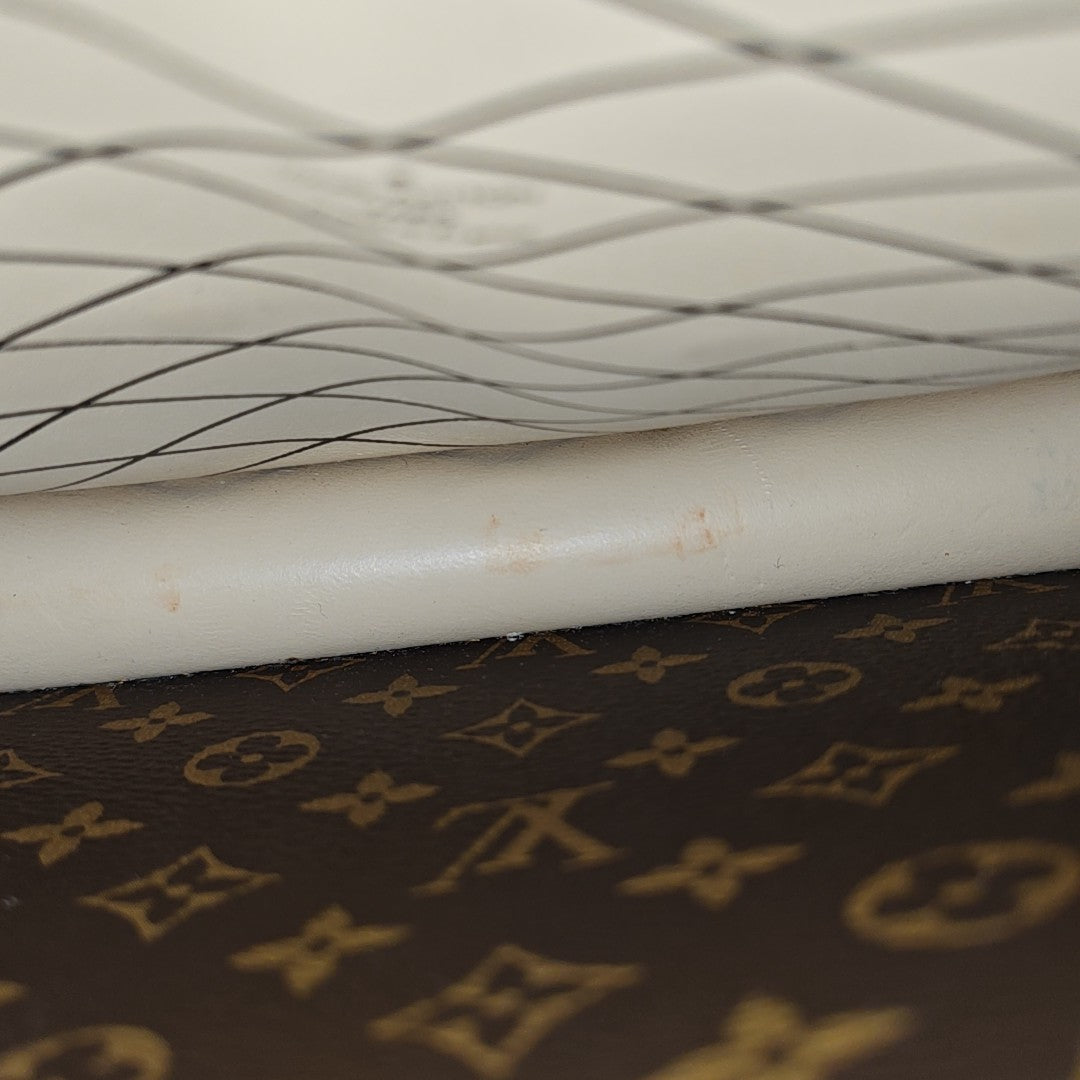 TRUNK Monogram Coated Canvas Brown