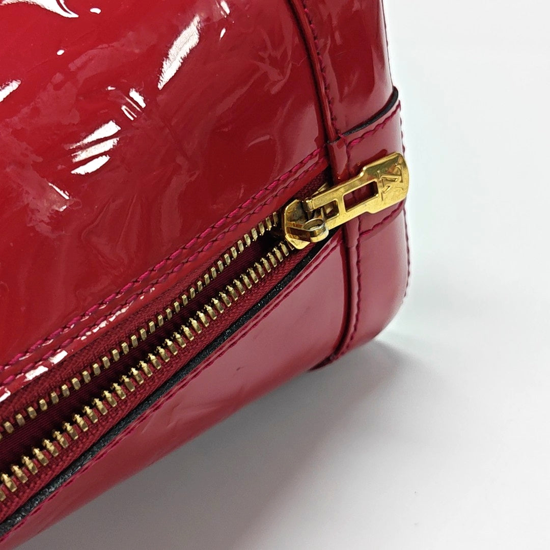 Authenticated pre-owned  ALMA PM Monogram Patent Leather Red - Top Handle Bag at Looply