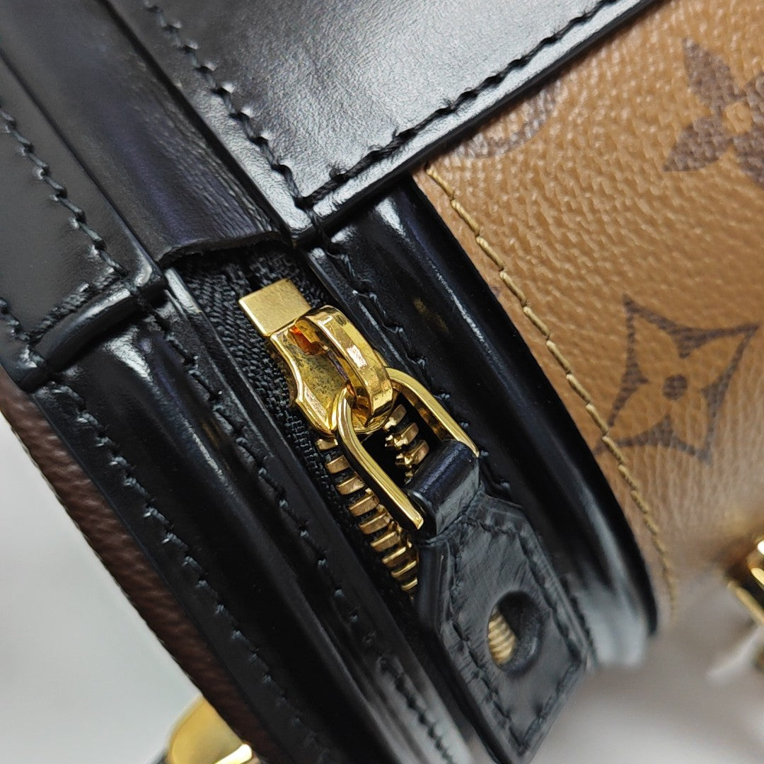 CANNES PM Monogram Coated Canvas Brown