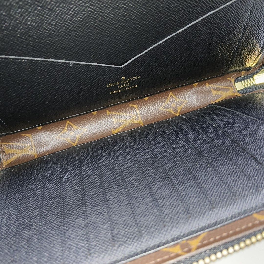 Monogram Coated Canvas Clutch Brown