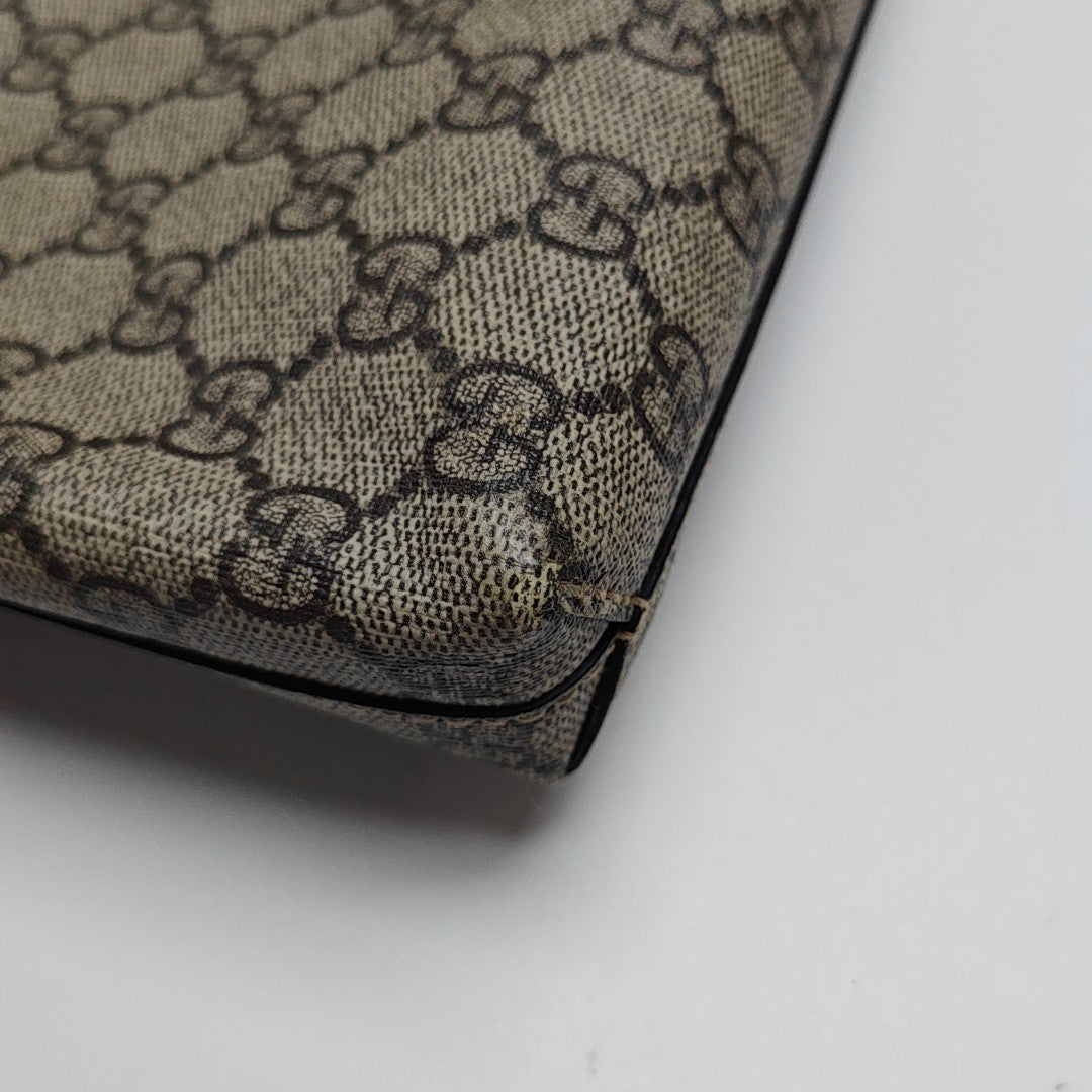 Monogram Coated Canvas Clutch Brown