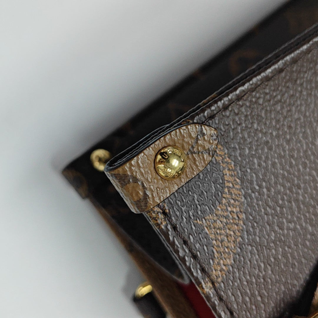 ONTHEGO PM Monogram Coated Canvas Brown