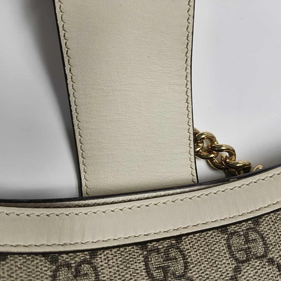 Padlock Small Monogram Coated Canvas Beige