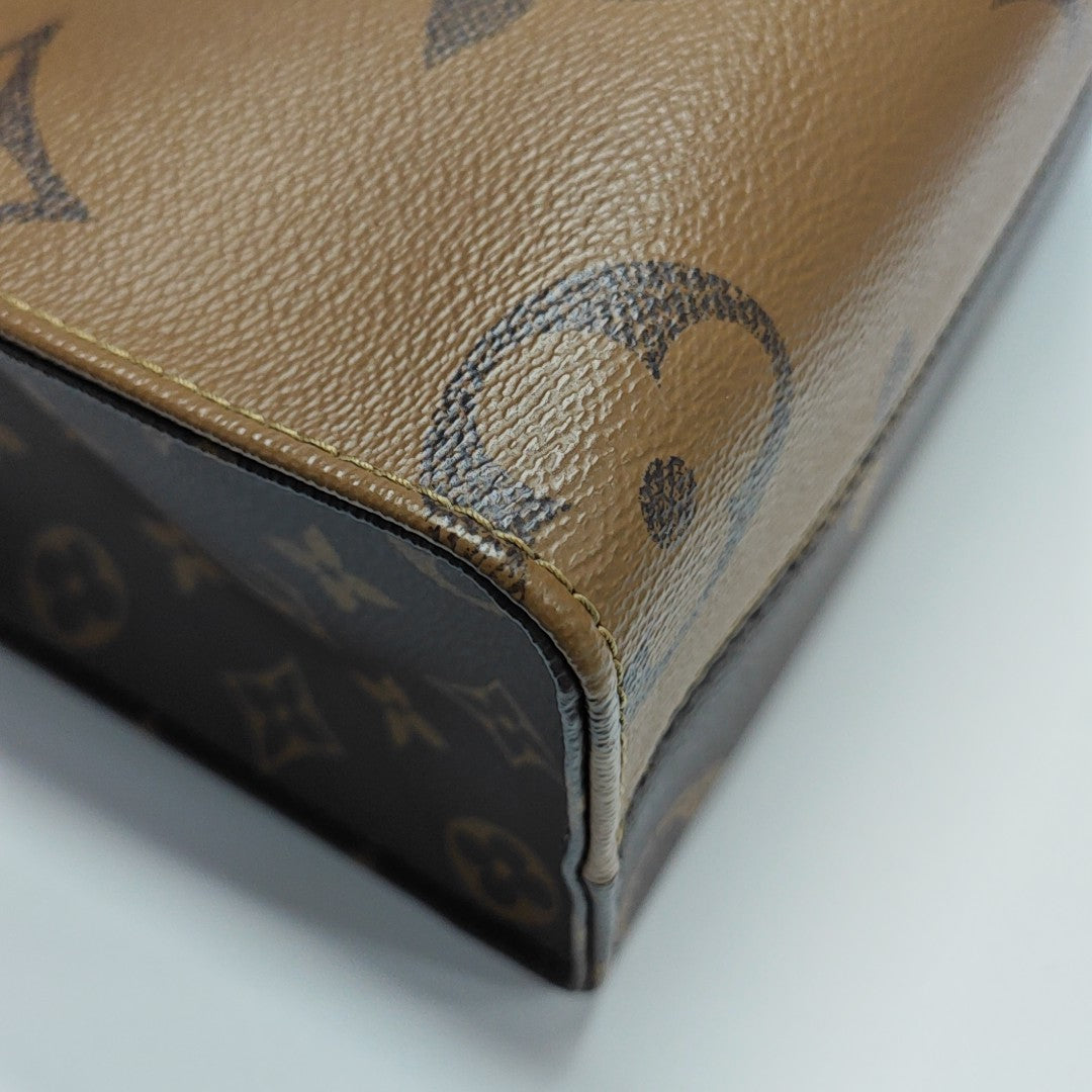 ONTHEGO PM Monogram Coated Canvas Brown