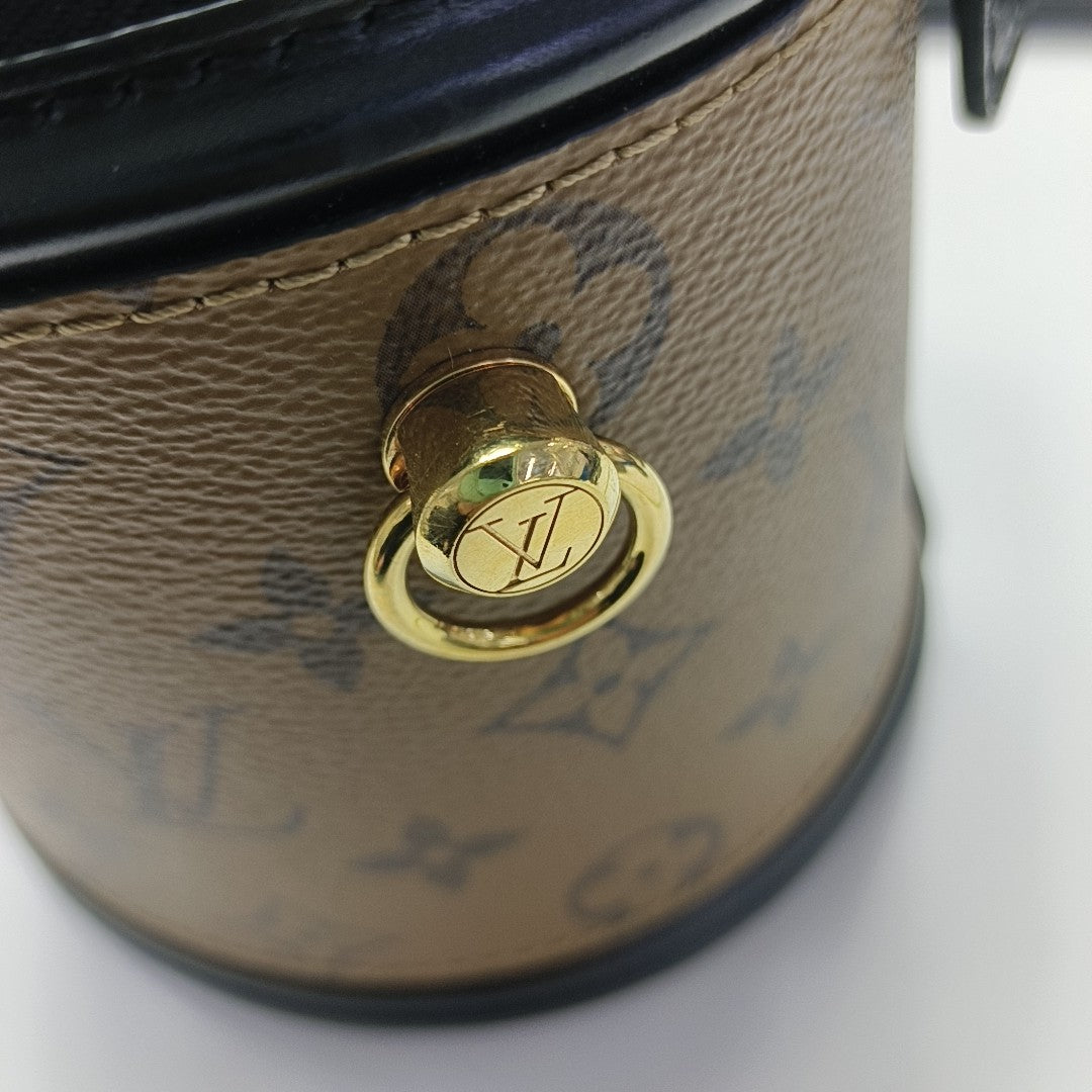 CANNES PM Monogram Coated Canvas Brown
