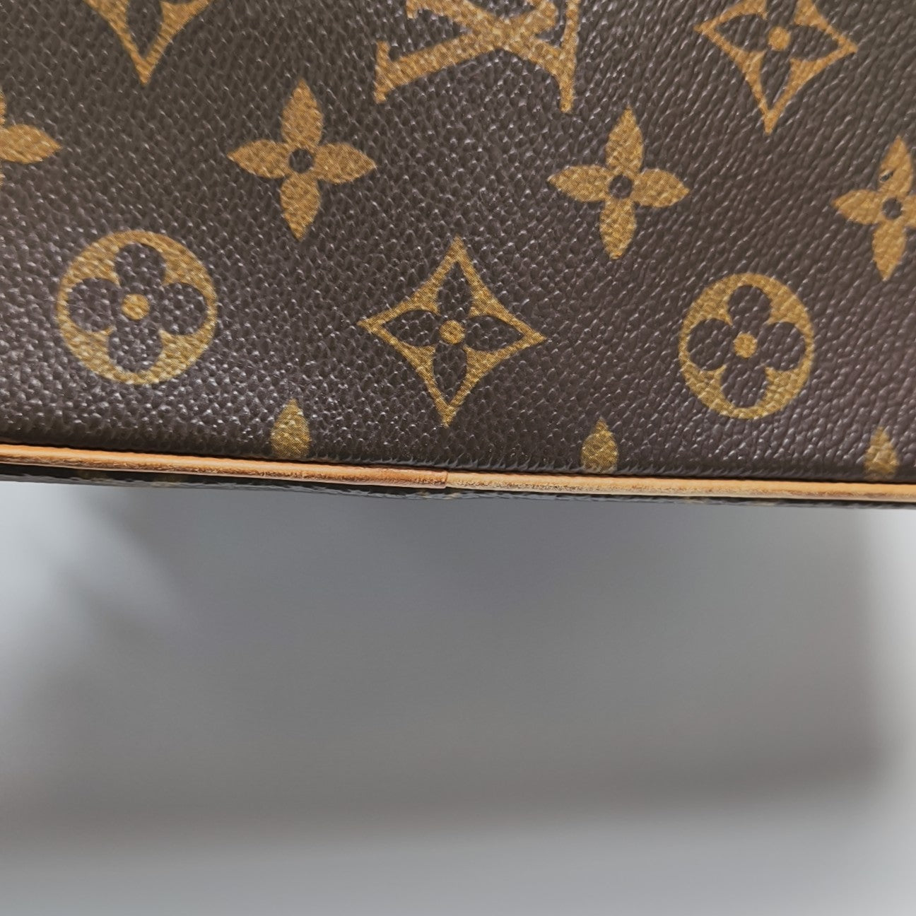 EXCENTRI-CITE Monogram Coated Canvas Brown