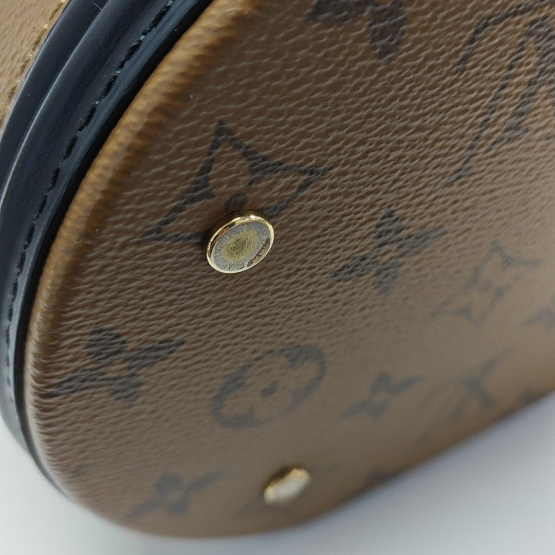 CANNES PM Monogram Coated Canvas Brown