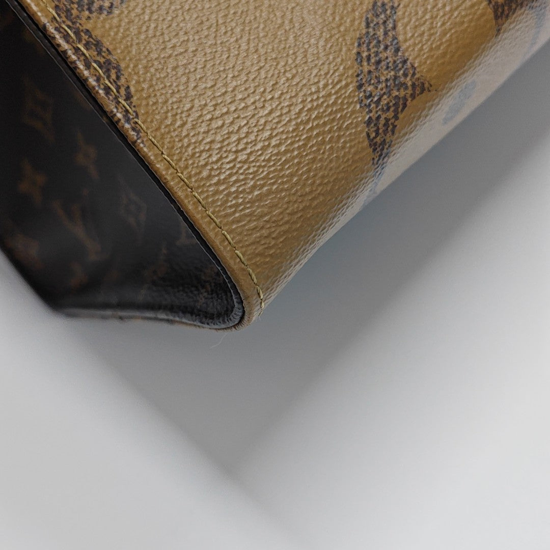 ONTHEGO GM Monogram Coated Canvas Brown
