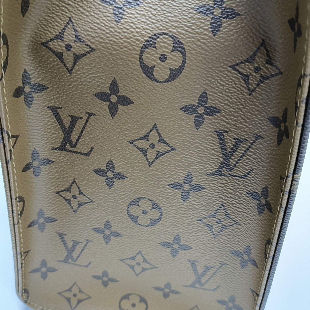 ONTHEGO MM Monogram Coated Canvas Brown