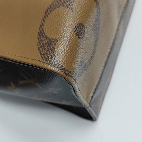 ONTHEGO MM Monogram Coated Canvas Brown