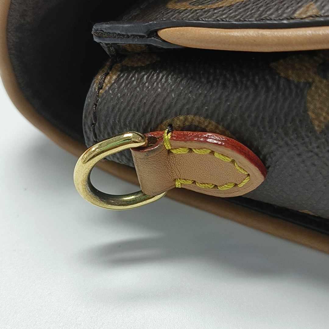 Pochette Camille Monogram Coated Canvas Brown