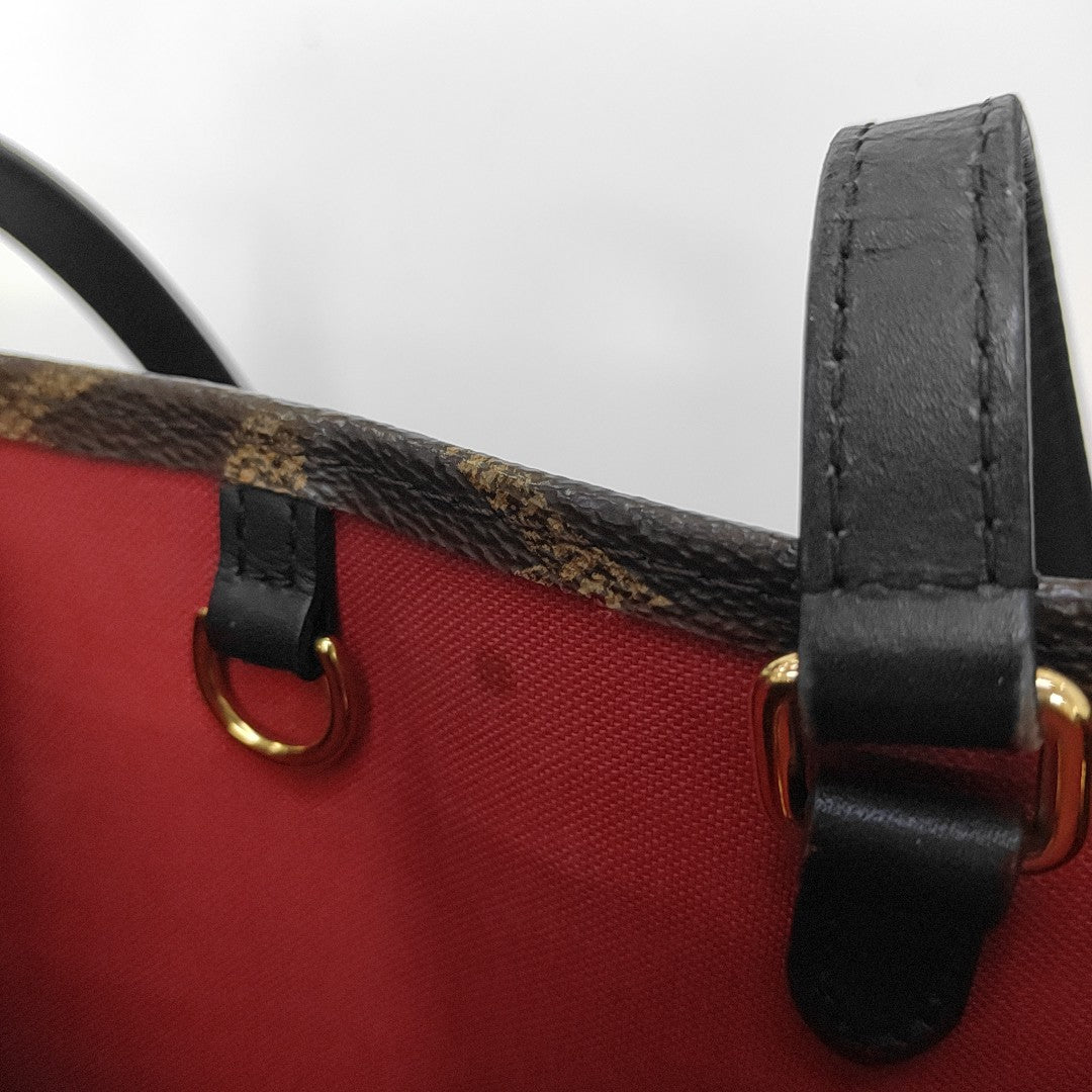 ONTHEGO MM Monogram Coated Canvas Brown