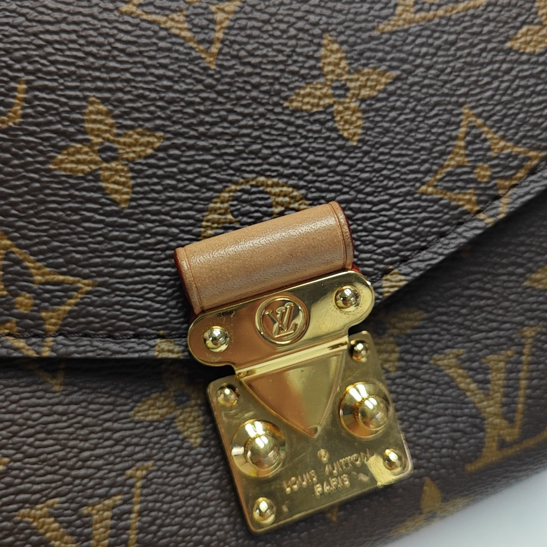 MÉTIS EAST WEST Monogram Coated Canvas Brown