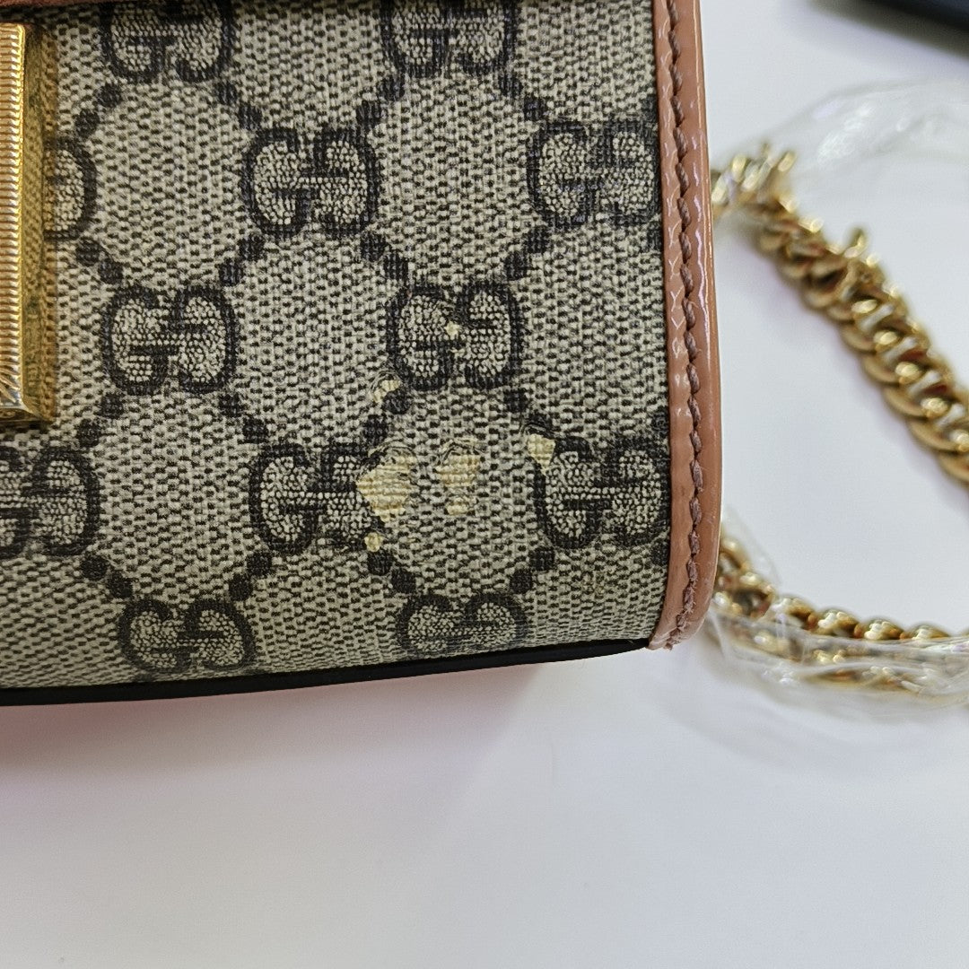 Candado pequeño Monogram lona revestida beige
