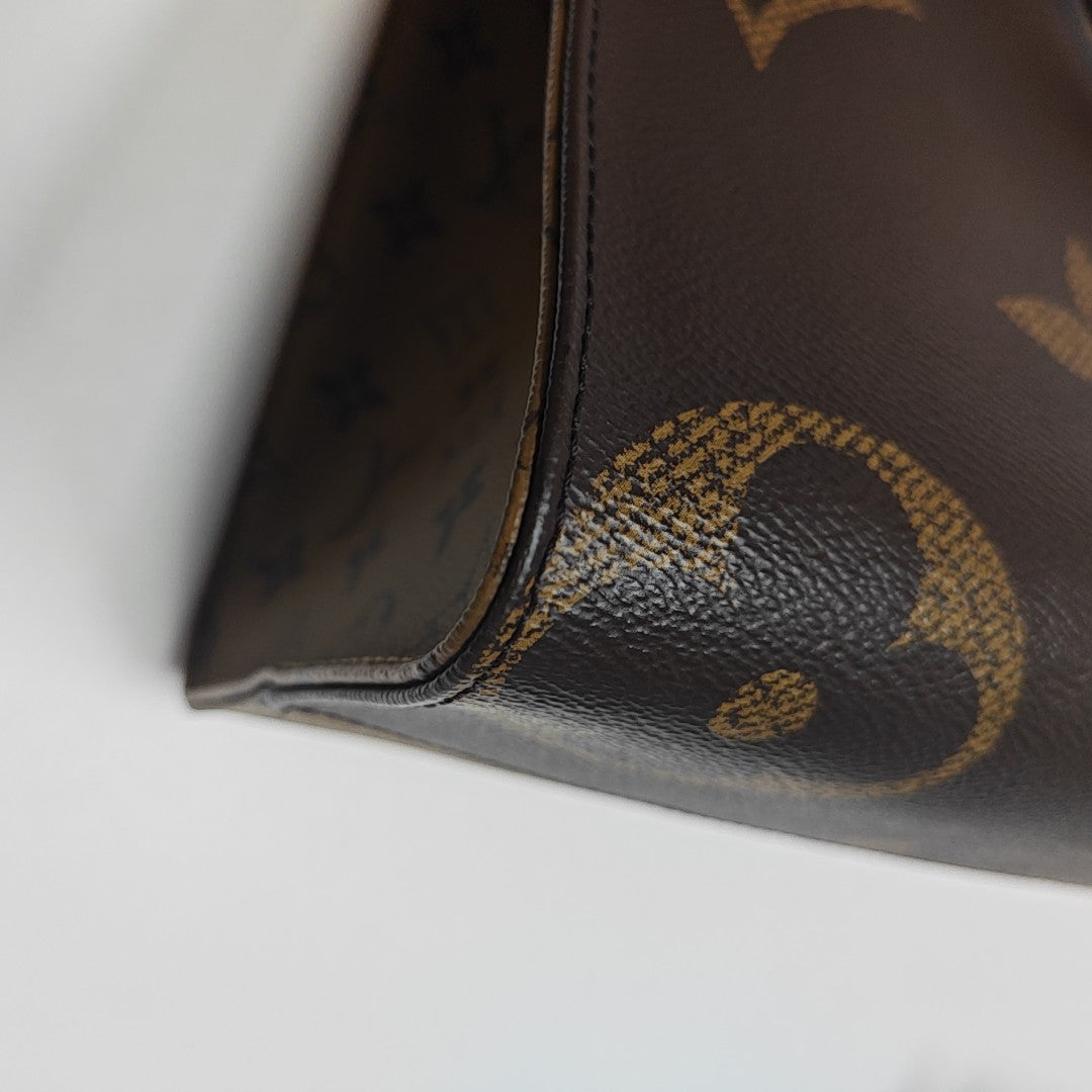 ONTHEGO MM Monogram Coated Canvas Brown