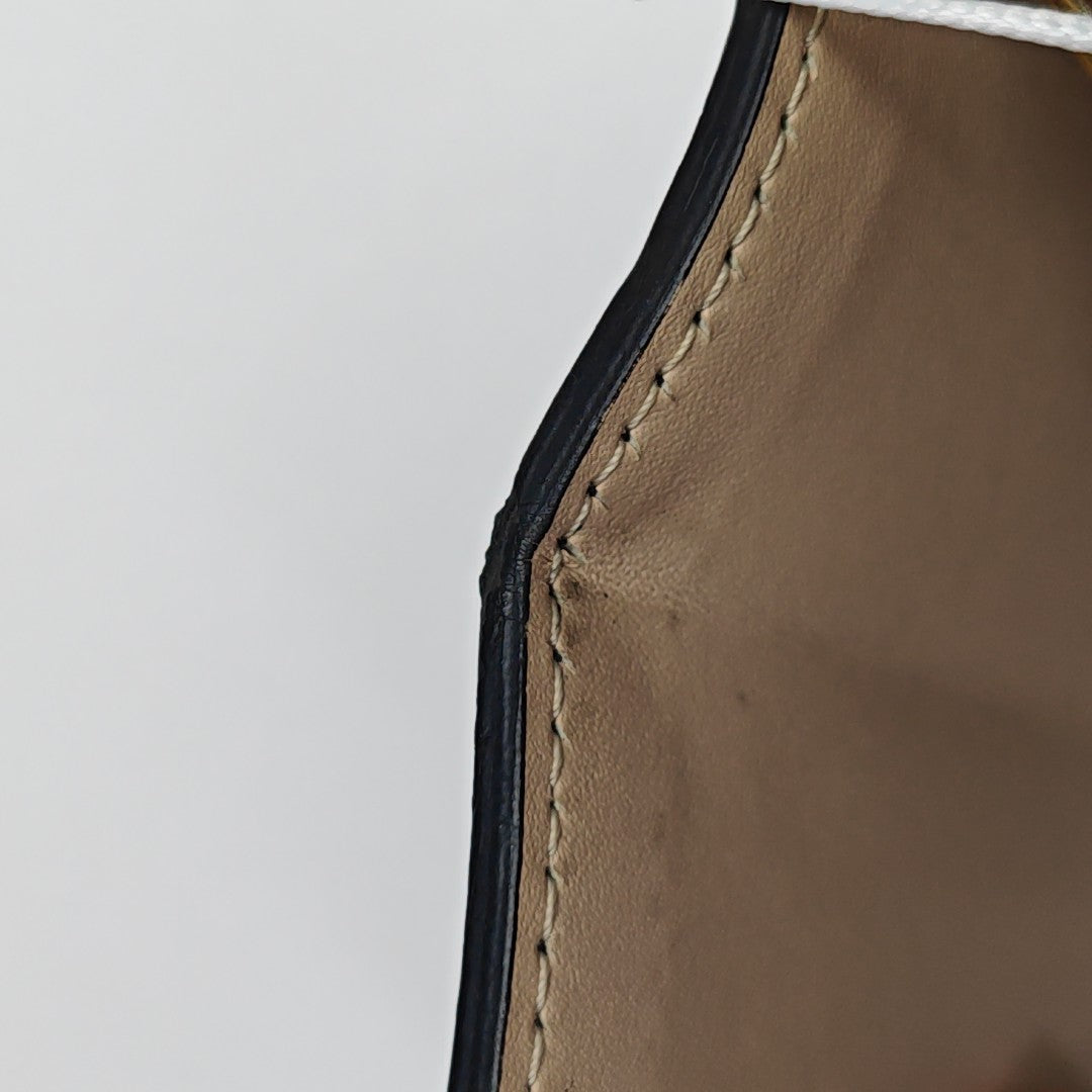 TRUNK Monogram Coated Canvas Brown
