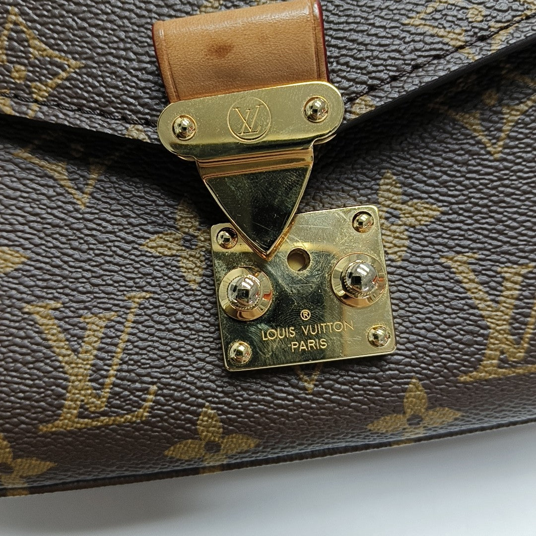 MÉTIS EAST WEST Monogram Coated Canvas Brown