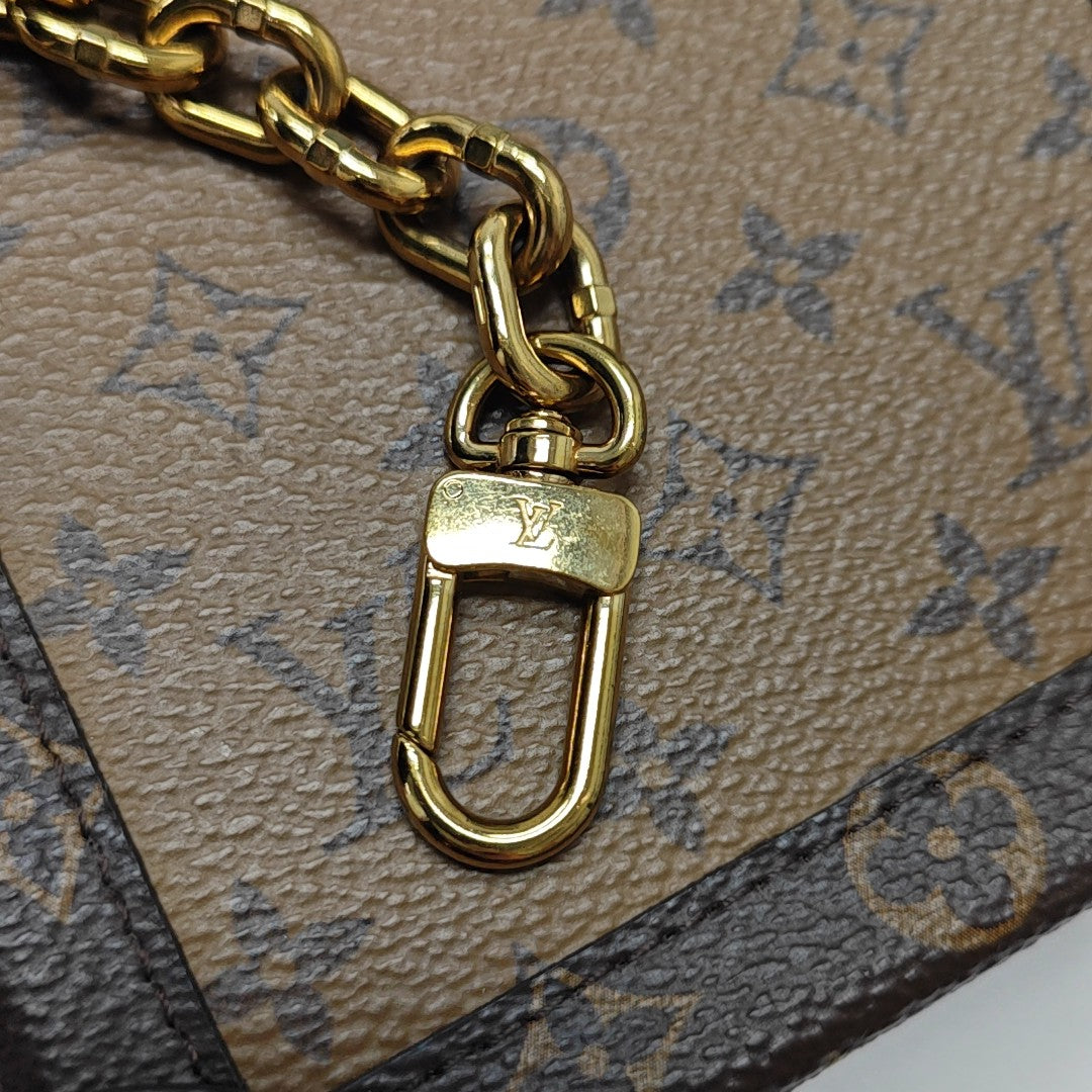 TRUNK Monogram Coated Canvas Brown