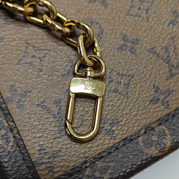 TRUNK Monogram Coated Canvas Brown