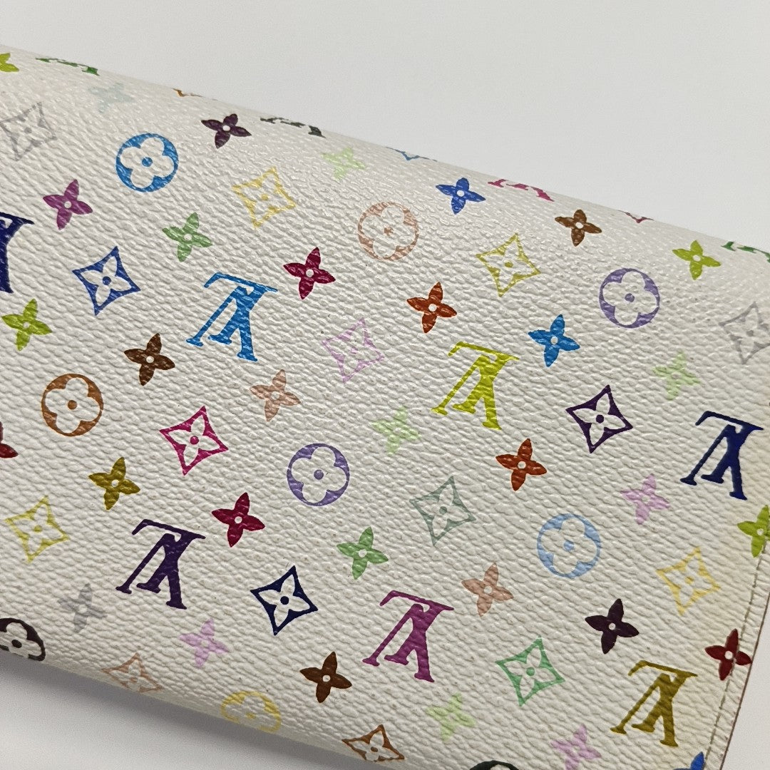 Monedero Monogram en lona revestida blanca