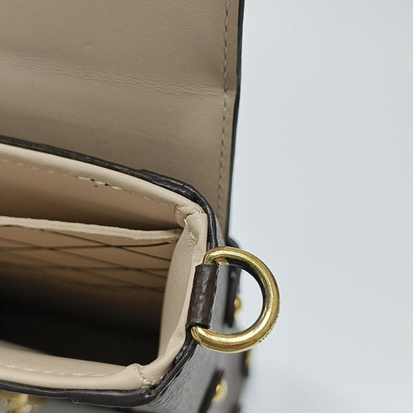 TRUNK Monogram Coated Canvas Brown