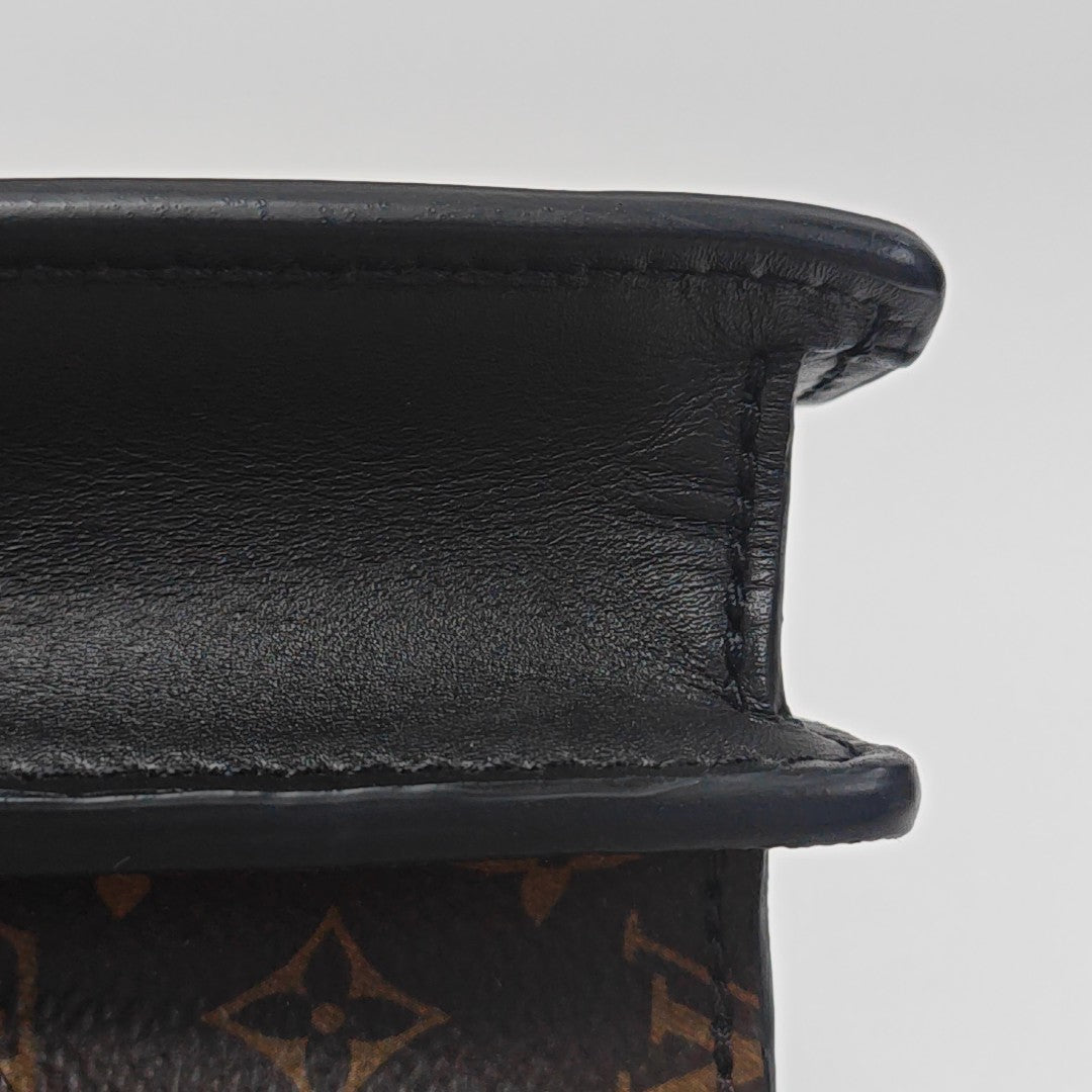 TRUNK Monogram Coated Canvas Brown