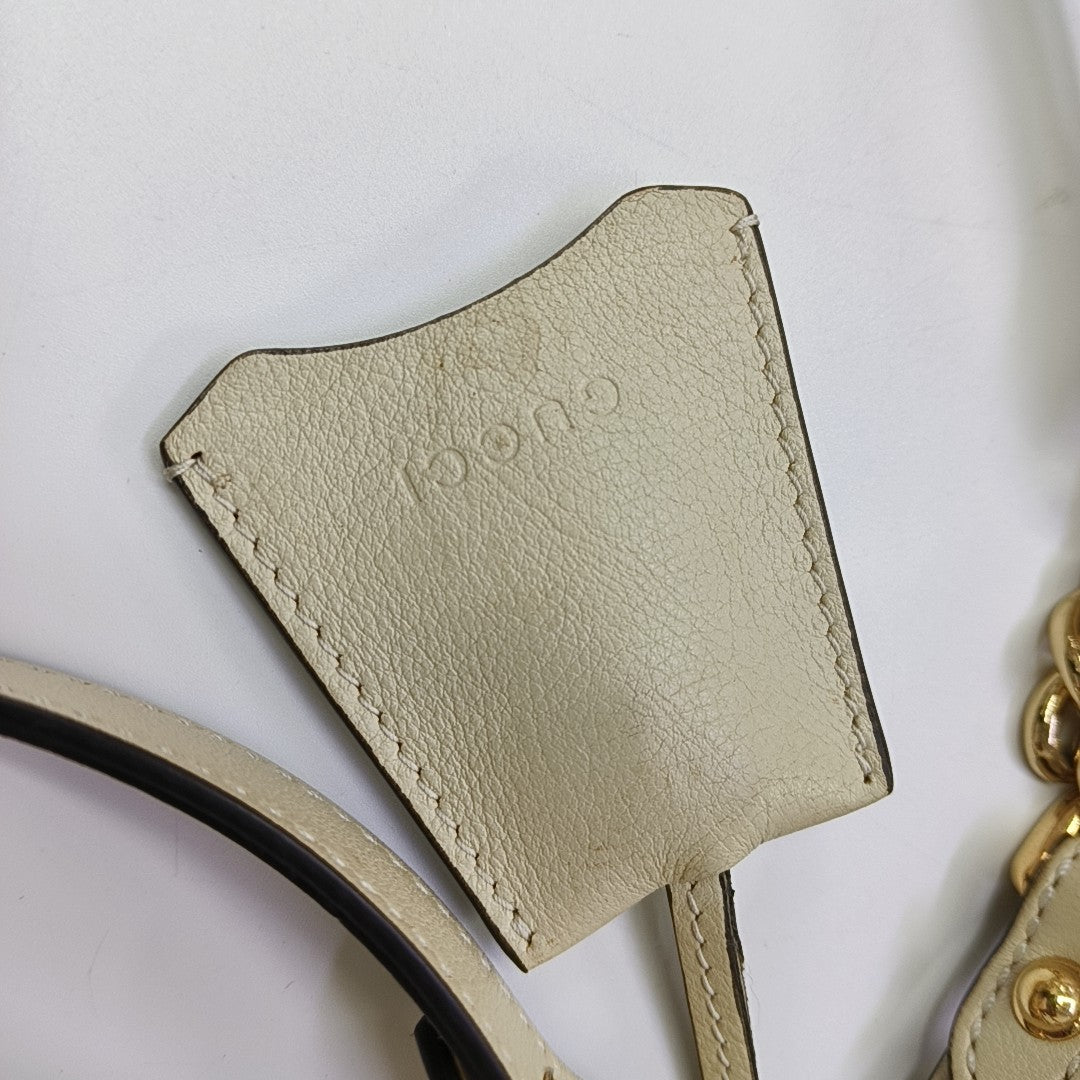Padlock Small Monogram Coated Canvas Beige