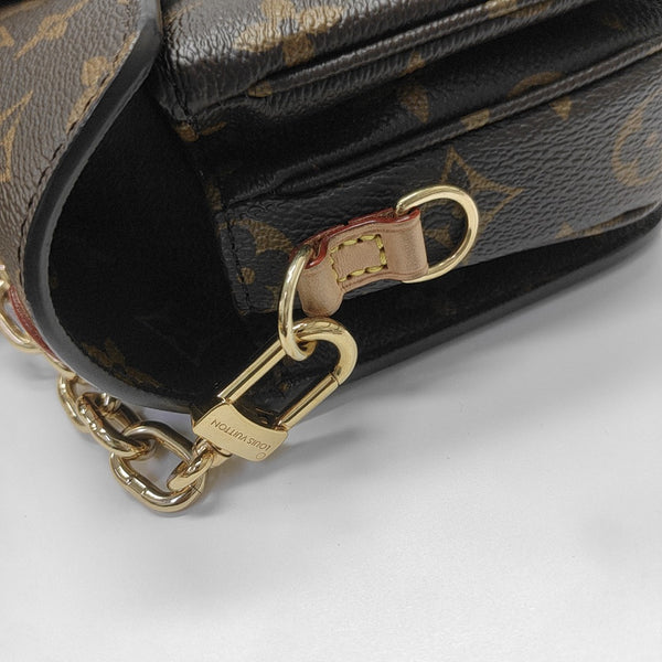 MÉTIS EAST WEST Monogram Coated Canvas Brown