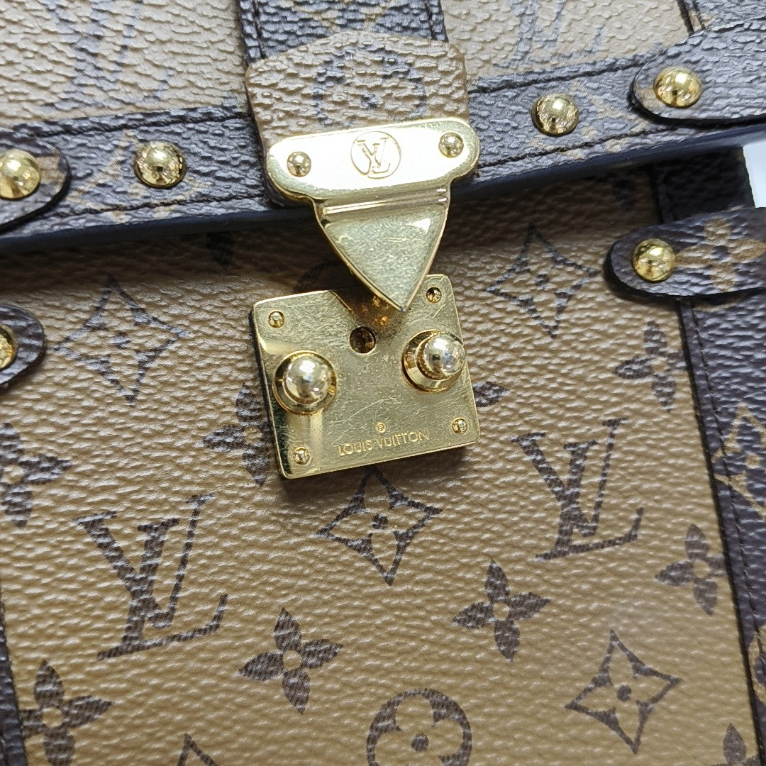 TRUNK Monogram Coated Canvas Brown