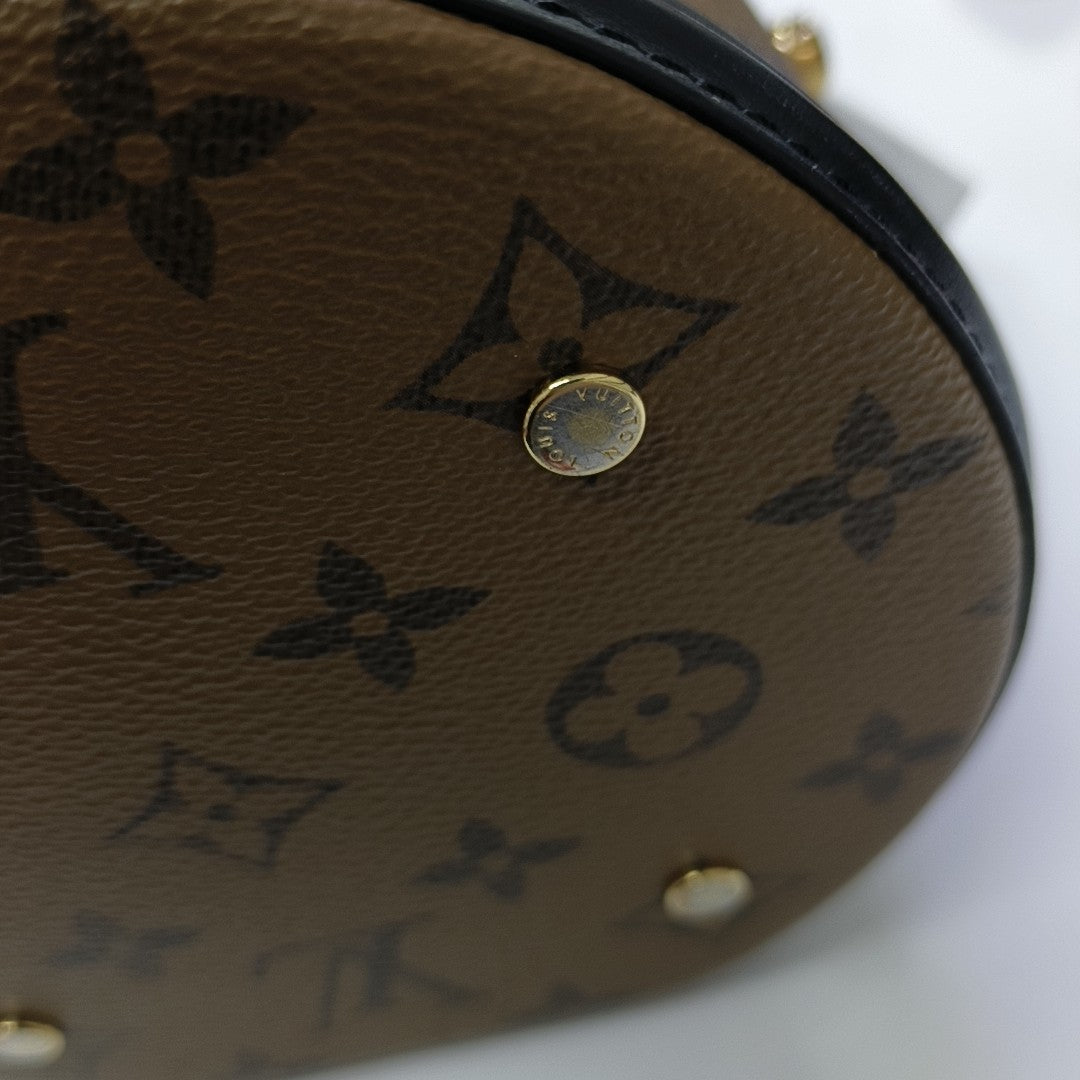 CANNES PM Monogram Coated Canvas Brown