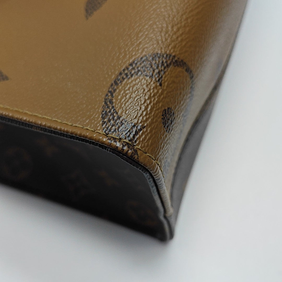 ONTHEGO PM Monogram Coated Canvas Brown