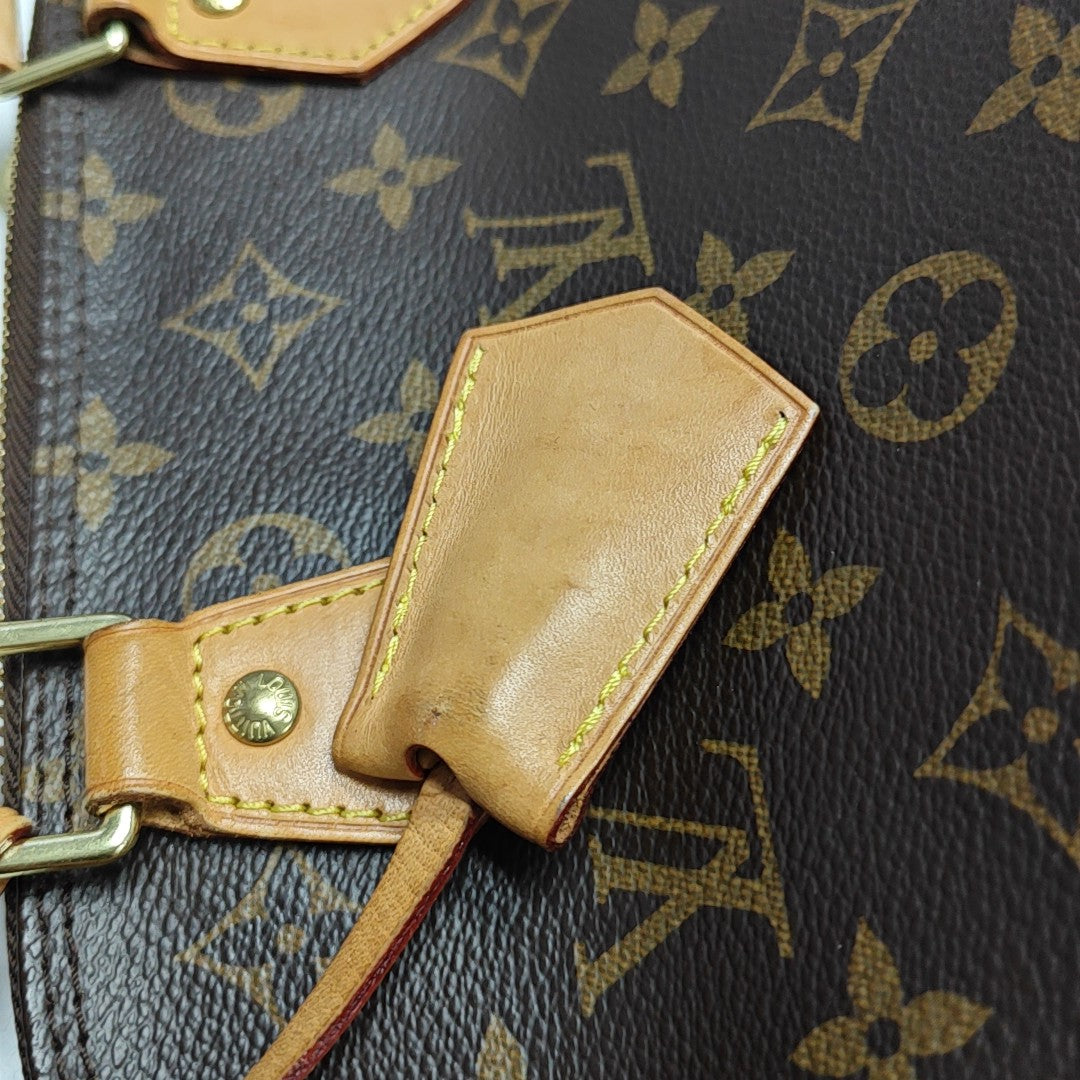 ALMA PM Monogram Coated Canvas Brown